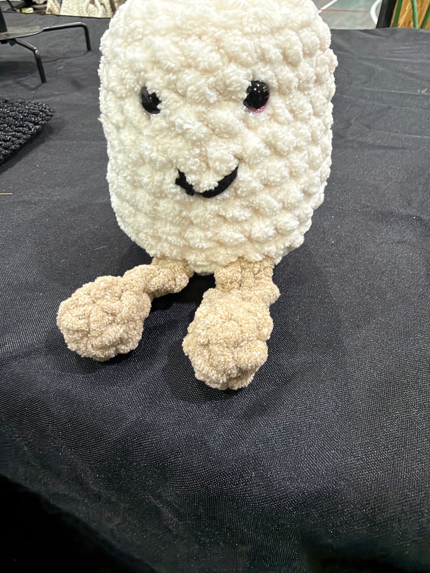 Crocheted marshmallow with legs